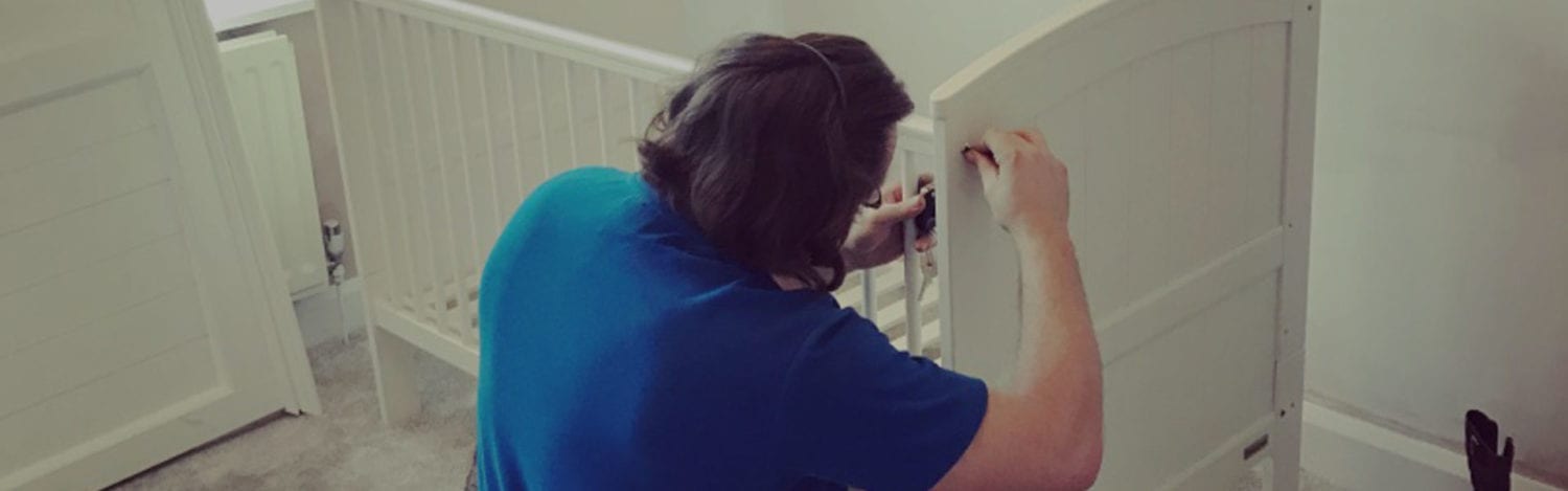 Removals crew fitting door frame protection before an office move Removals crew fitting door frame protection before an office move